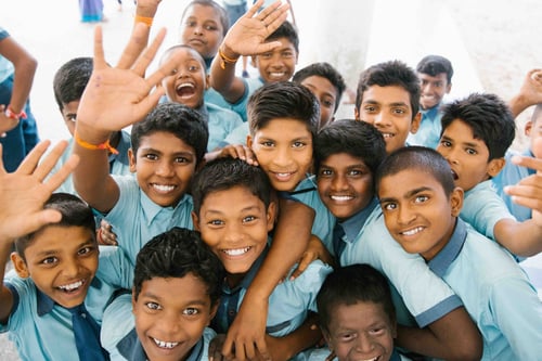 Using CogAT Score Profiles to Differentiate Instruction; students waving at camera