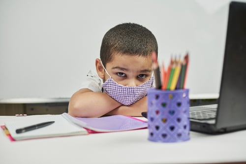Young special ed student upset while remote learning.