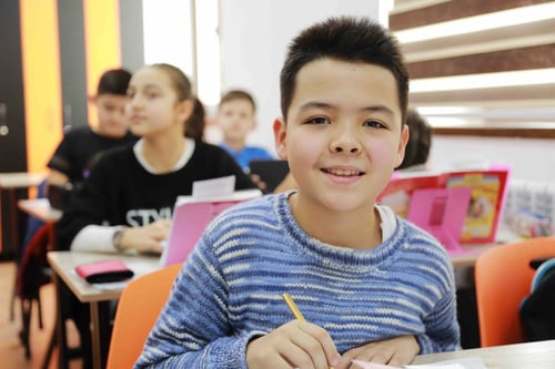 Child smiling in classroom